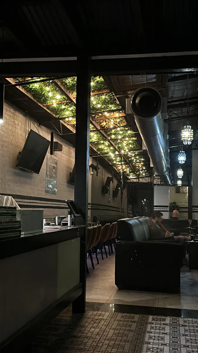 The upstairs shisha lounge under the fairy-light ceiling